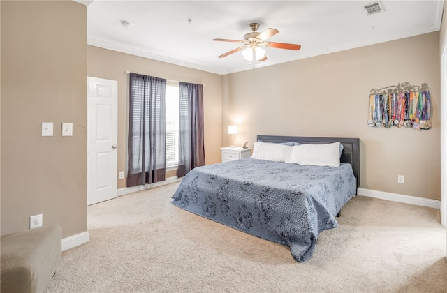 bedroom with ornamental molding, carpet, and visible vents