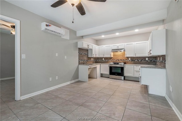 kitchen with ceiling fan, stainless steel appliances, an AC wall unit, backsplash, and white cabinets