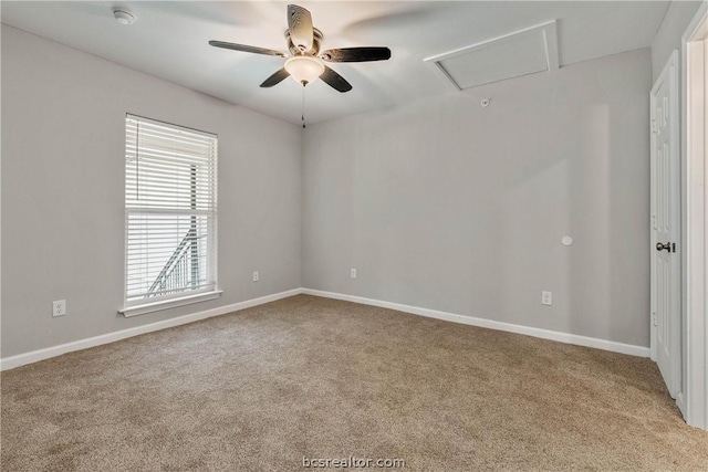 empty room featuring ceiling fan and light carpet