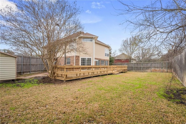 view of yard featuring a fenced backyard and a deck