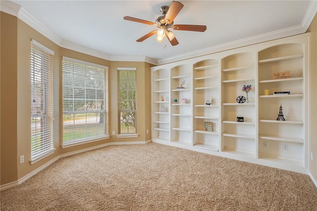 unfurnished room featuring ornamental molding, a healthy amount of sunlight, and carpet flooring