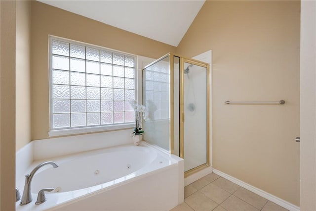 bathroom with baseboards, lofted ceiling, tile patterned floors, a whirlpool tub, and a shower stall