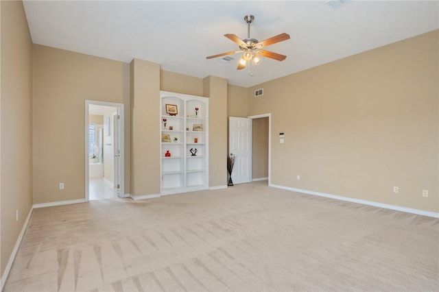 1605 Dominik Dr, College Station, TX 77840 - unfurnished bedroom with light carpet, baseboards, connected bathroom, and a ceiling fan