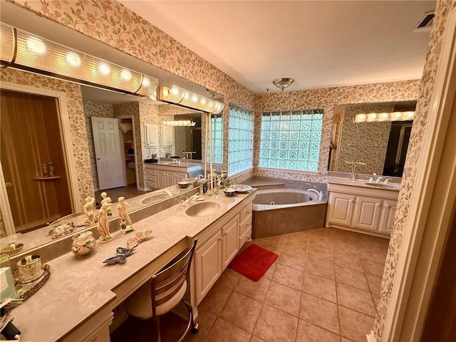 40 Casper Pl, Hilltop Lakes, TX 77871 - full bathroom featuring wallpapered walls, tile patterned flooring, a garden tub, and two vanities