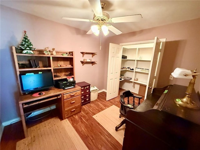 40 Casper Pl, Hilltop Lakes, TX 77871 - office area featuring wood finished floors, ceiling fan, and baseboards