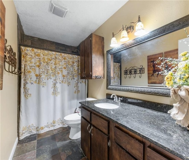 full bathroom with visible vents, toilet, stone finish flooring, a textured ceiling, and vanity