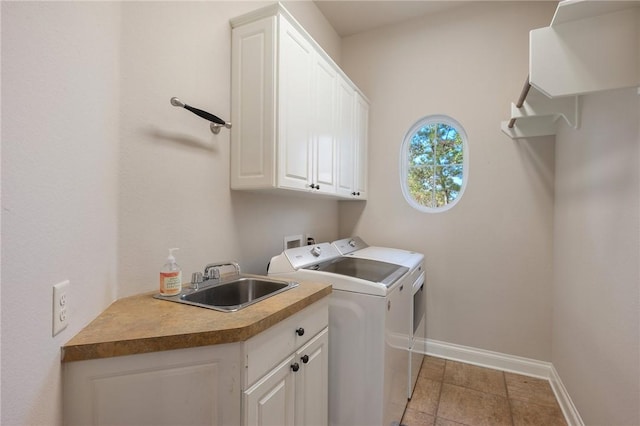 laundry area with separate washer and dryer, sink, light tile patterned flooring, and cabinets