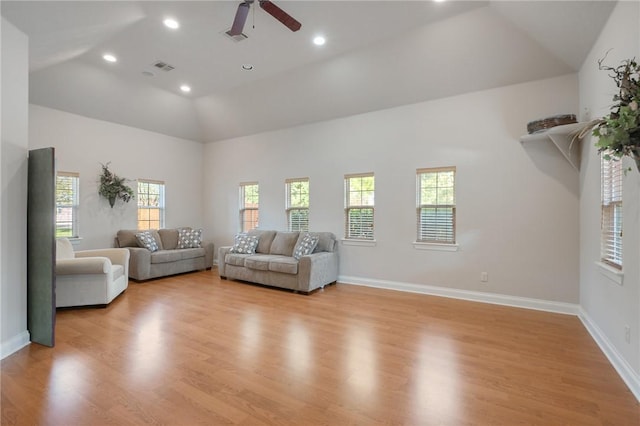 unfurnished living room featuring high vaulted ceiling, light hardwood / wood-style flooring, and ceiling fan