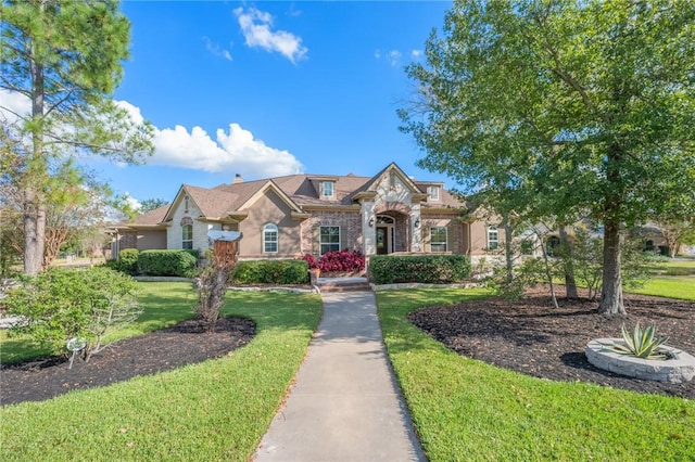 view of front of home with a front yard