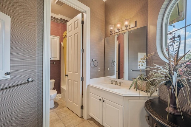 bathroom with tile patterned floors, vanity, and toilet