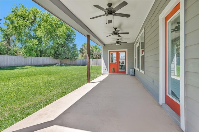 291 Berkley Dr, Montgomery, TX 77356 - fenced backyard featuring a ceiling fan and a patio area