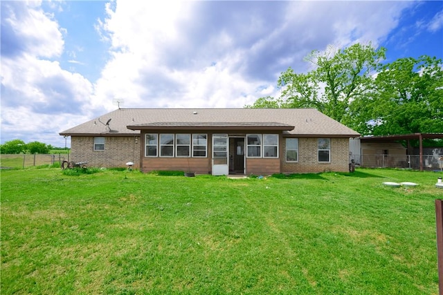 7523 State Highway 21 W, Caldwell, TX 77836 - back of property with brick siding, roof with shingles, and a sunroom
