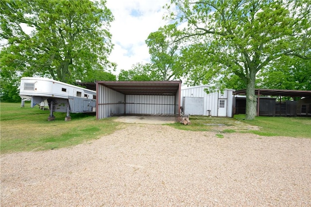 7523 State Highway 21 W, Caldwell, TX 77836 - garage featuring a detached carport and driveway