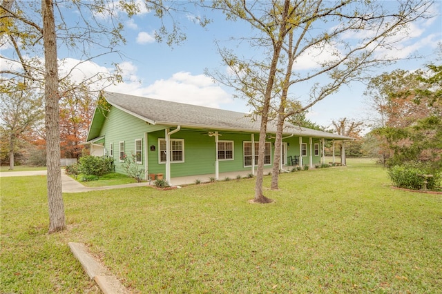 exterior space with a front lawn and a porch