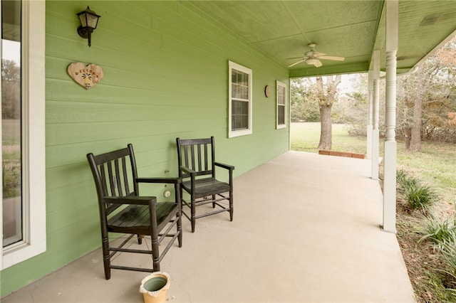 view of patio with ceiling fan and a porch