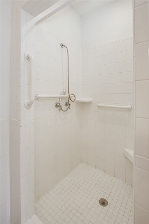 bathroom with tiled shower