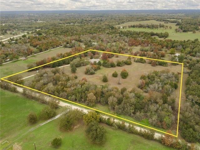 birds eye view of property featuring a rural view