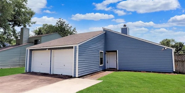 garage featuring a yard