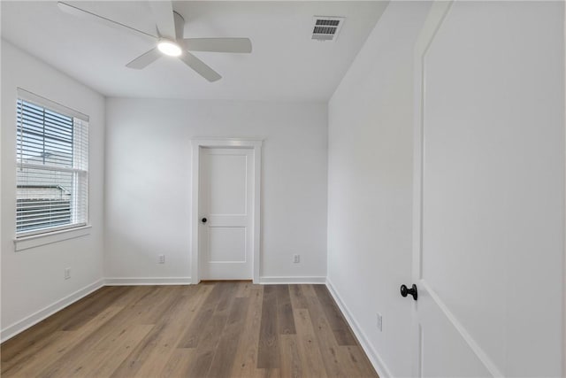 spare room with ceiling fan and light hardwood / wood-style floors