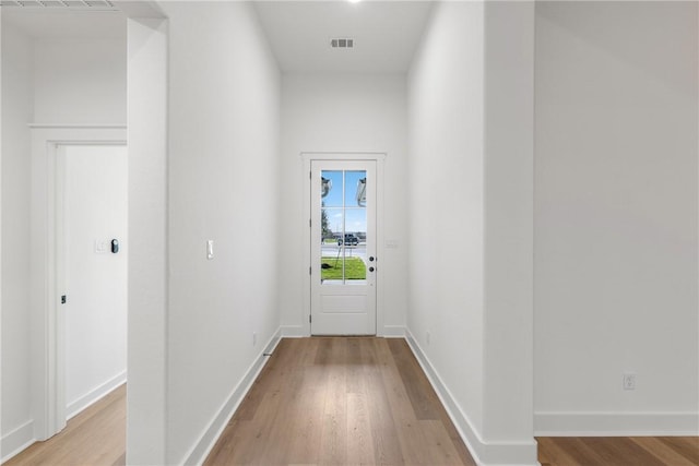 entryway with light hardwood / wood-style floors