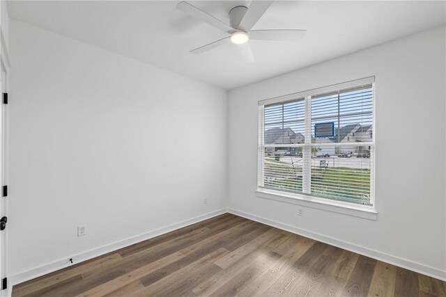 empty room with ceiling fan and wood-type flooring