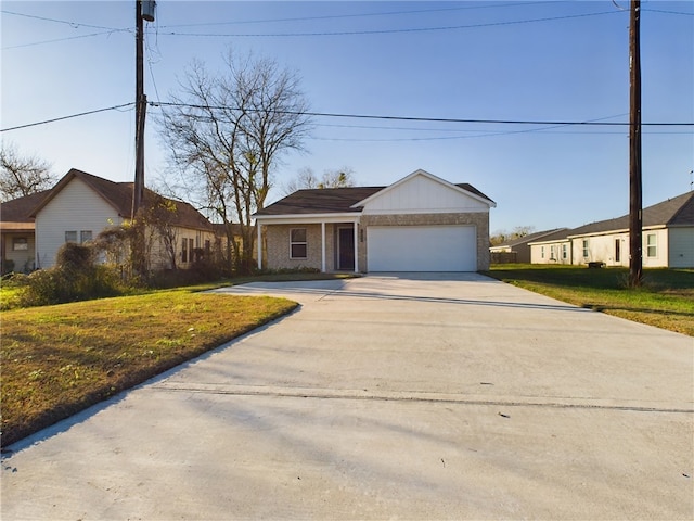 ranch-style house with a garage and a front lawn