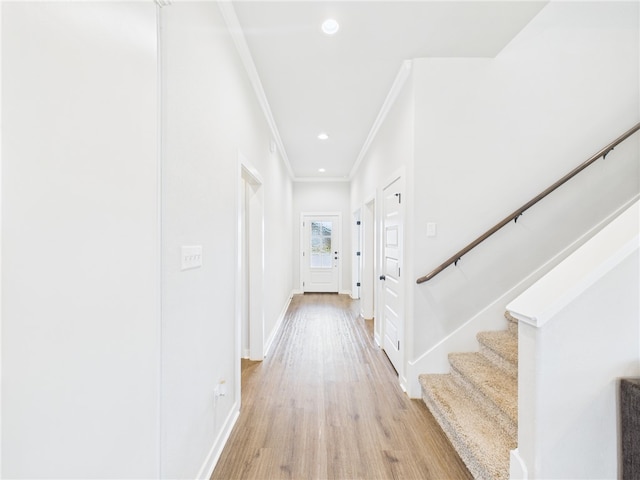 3903 Brownway Ct, College Station, TX 77845 - corridor featuring ornamental molding, light wood finished floors, stairway, baseboards, and recessed lighting
