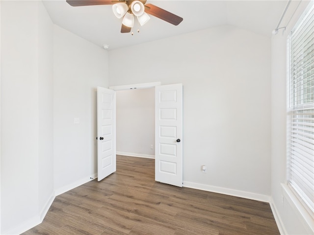 3903 Brownway Ct, College Station, TX 77845 - unfurnished bedroom with lofted ceiling, wood finished floors, ceiling fan, and baseboards