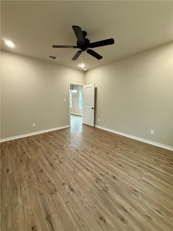 unfurnished room featuring ceiling fan and light wood-type flooring