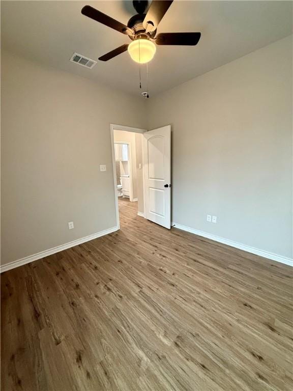 unfurnished room featuring ceiling fan and light hardwood / wood-style floors