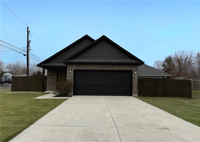 view of front of property featuring a garage and a front yard