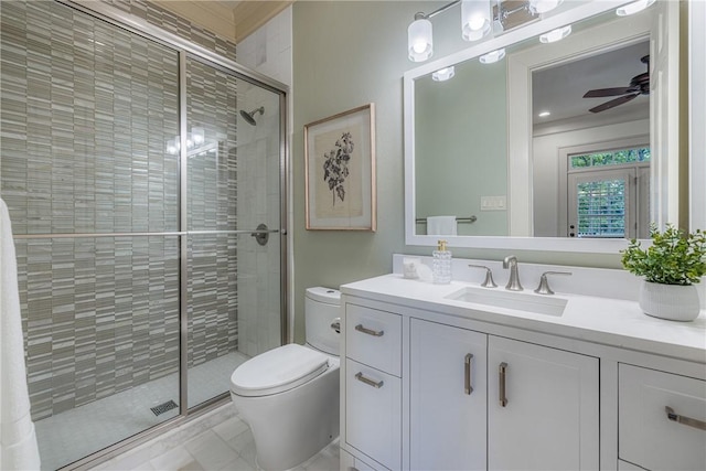 full bath featuring a stall shower, toilet, ceiling fan, and vanity