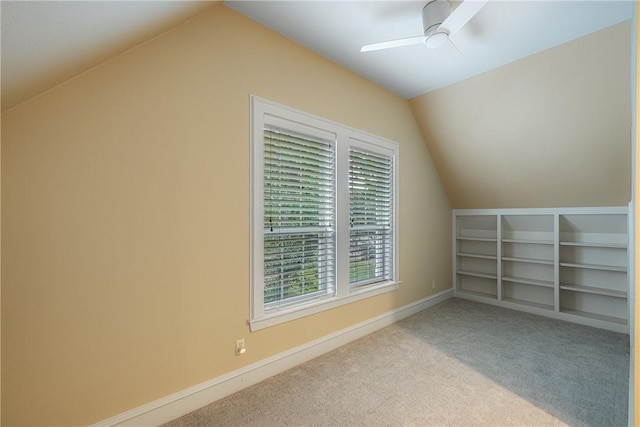 bonus room featuring ceiling fan, light colored carpet, and lofted ceiling