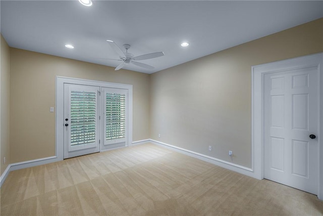 carpeted spare room featuring baseboards, recessed lighting, and ceiling fan