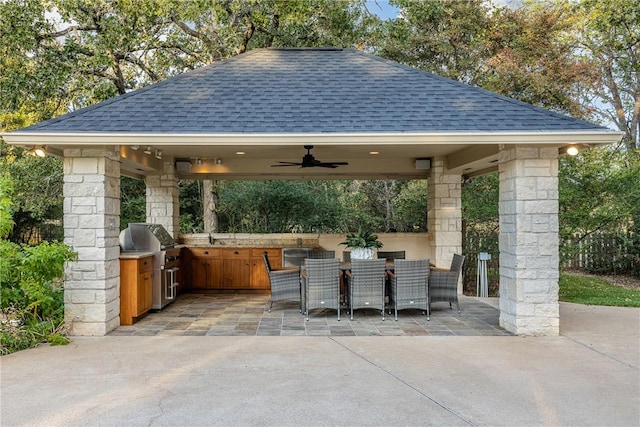 view of patio with a gazebo, area for grilling, ceiling fan, and grilling area