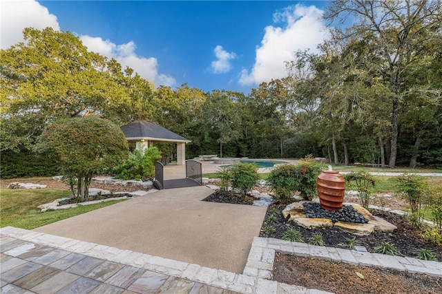 surrounding community featuring a gazebo, a patio, and a swimming pool