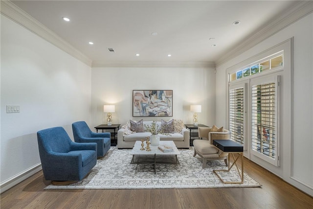 living room featuring wood-type flooring and crown molding