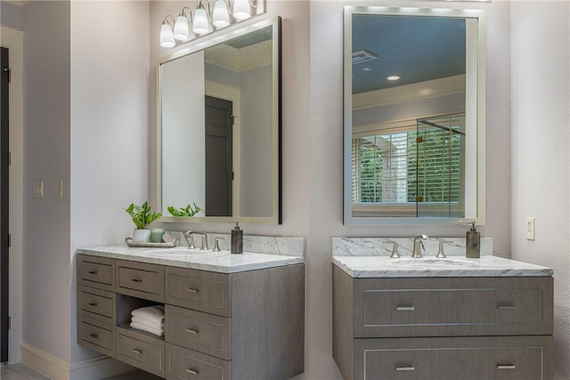 bathroom with vanity and crown molding