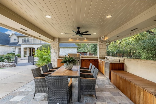 view of patio / terrace with grilling area, area for grilling, ceiling fan, and sink