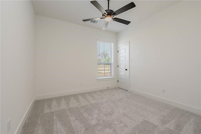 spare room with light carpet and ceiling fan