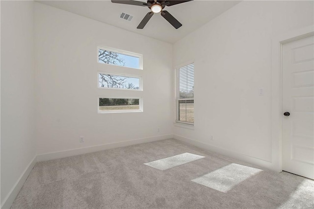 empty room with light colored carpet and ceiling fan