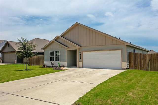 137 Windmill Rd, Snook, TX 77878 - view of front of house featuring stone siding, a garage, driveway, and board and batten siding