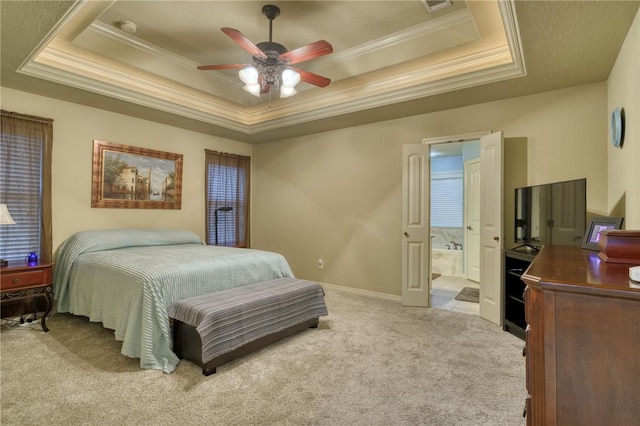 2703 Wood Ct, Bryan, TX 77808 - bedroom with a tray ceiling, light colored carpet, crown molding, ensuite bath, and ceiling fan