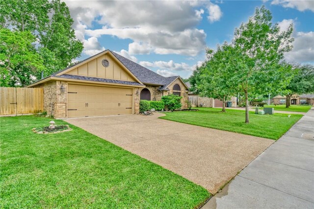 2703 Wood Ct, Bryan, TX 77808 - ranch-style house with board and batten siding, an attached garage, driveway, and brick siding