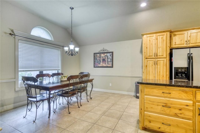 2703 Wood Ct, Bryan, TX 77808 - dining area featuring vaulted ceiling, a chandelier, light tile patterned floors, and baseboards