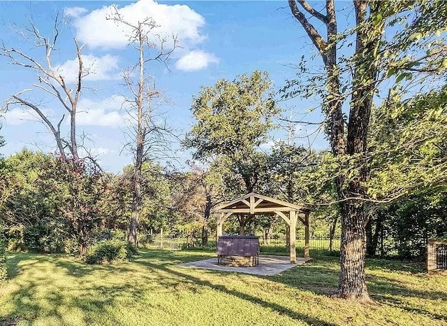 view of yard with a gazebo, a patio, and fence