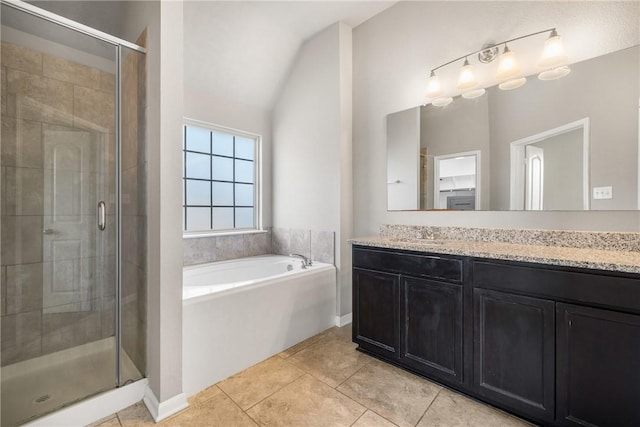 2099 Positano Loop, Bryan, TX 77808 - bathroom with a garden tub, vanity, a stall shower, tile patterned flooring, and lofted ceiling