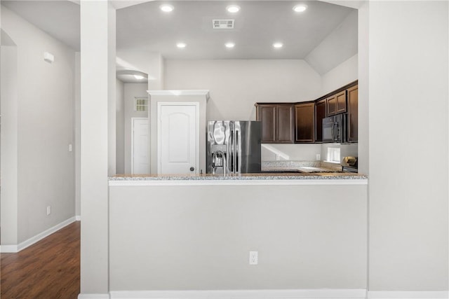 2099 Positano Loop, Bryan, TX 77808 - kitchen featuring stainless steel appliances, dark brown cabinets, dark wood-type flooring, recessed lighting, and baseboards