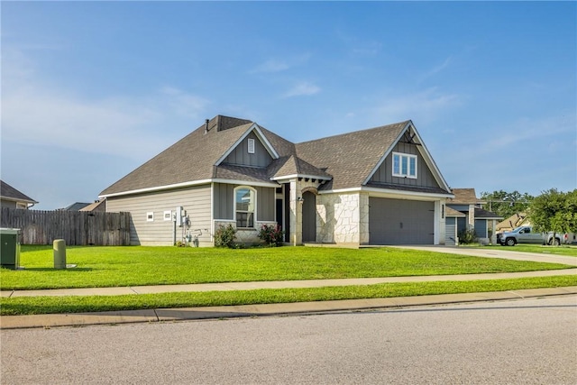 2099 Positano Loop, Bryan, TX 77808 - view of front facade featuring board and batten siding, driveway, a garage, and roof with shingles