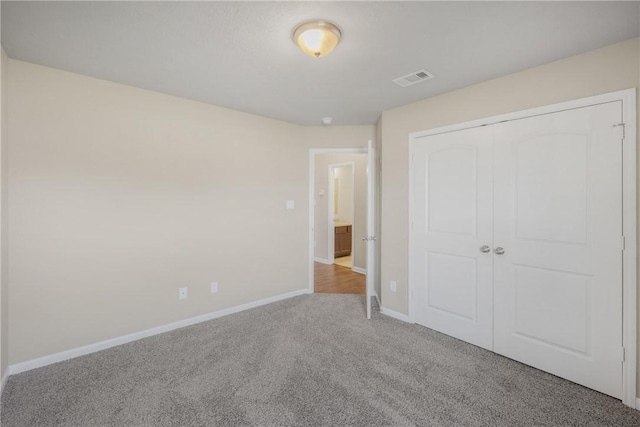 2099 Positano Loop, Bryan, TX 77808 - unfurnished bedroom featuring carpet flooring, baseboards, and a closet
